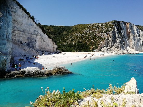 Fteri Beach Escape | A wild white-pebble beach with turquoise waters.